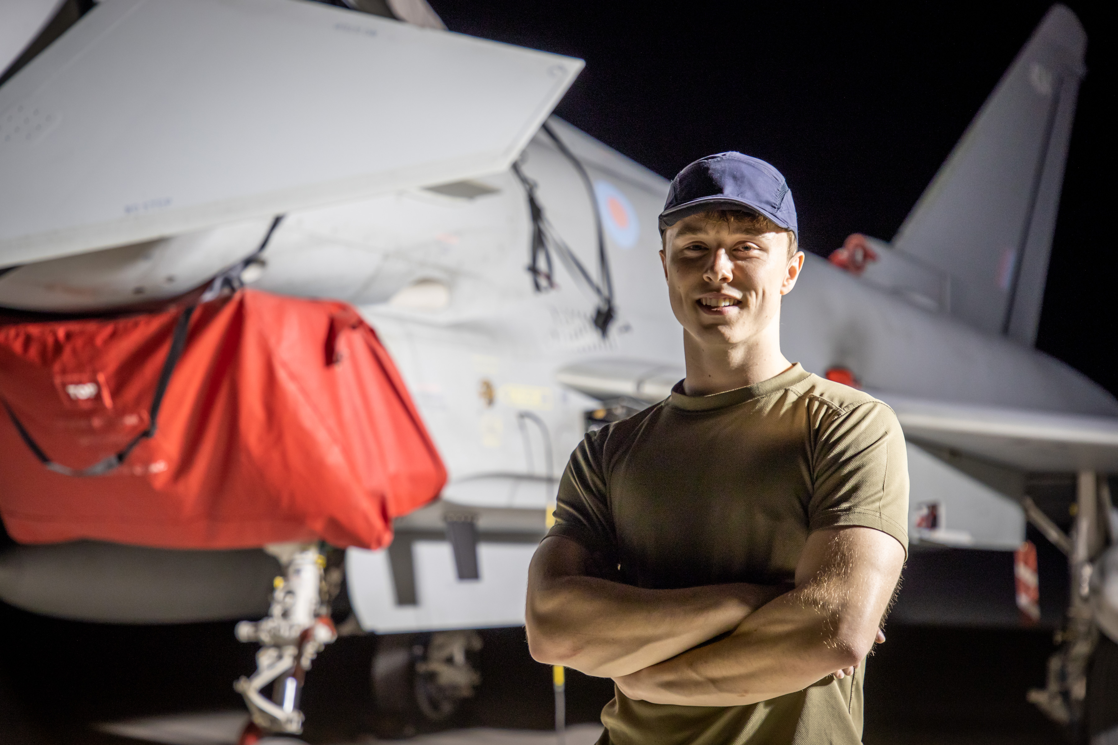 Personnel stands by aircraft.